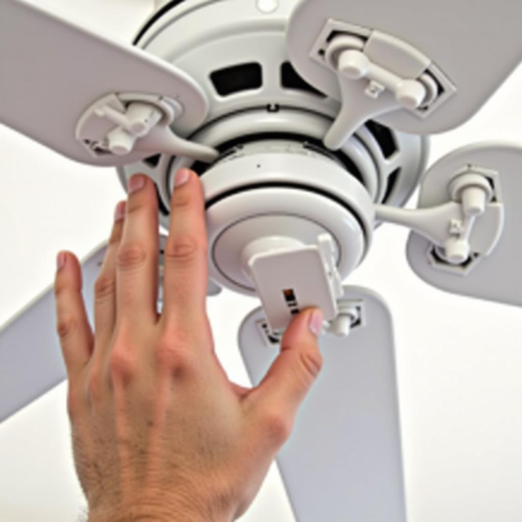 Close-up of Hand Flipping Ceiling Fan Switch