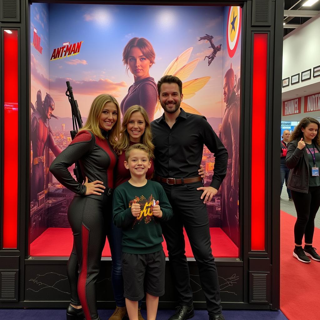 Fans pose for photos with Ant-Man and the Wasp