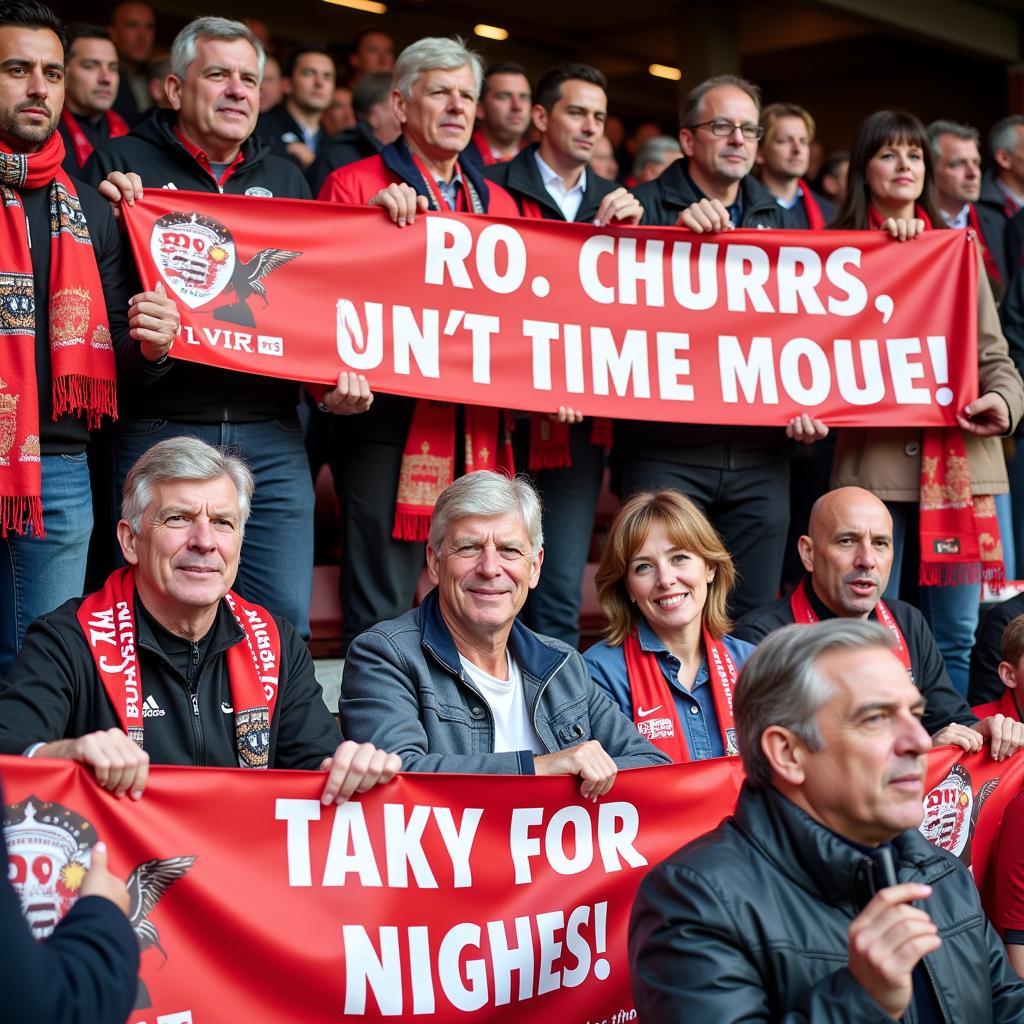 Arsenal fans holding banners in support of Arsene Wenger during his farewell