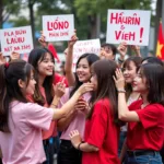 BLACKPINK Members Posing with Fans Holding Signs Displaying Vietnamese Nicknames