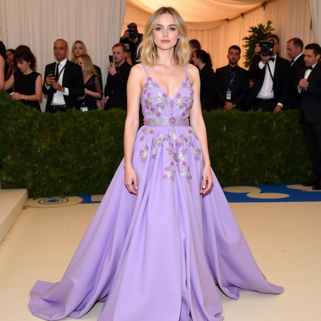 Dakota Fanning in lilac dress at Met Gala 2018