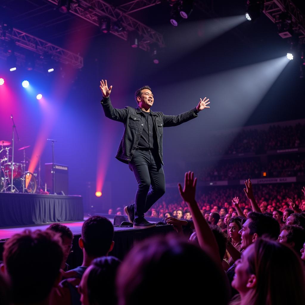 Dan Truong performing on stage in front of a large audience