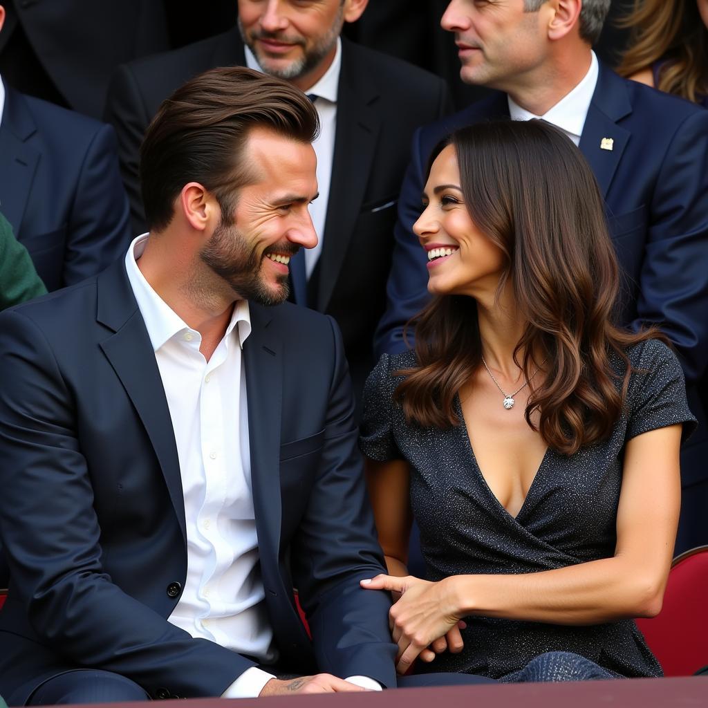 David and Victoria Beckham at a football event