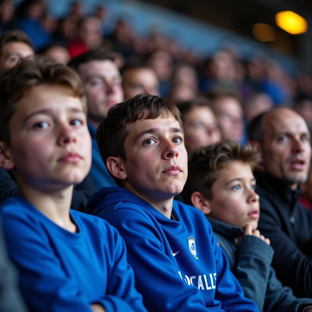 Diverse group of fans watching a football match