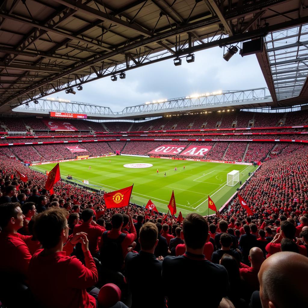 A panoramic view of Old Trafford stadium filled with Manchester United fans in 2018