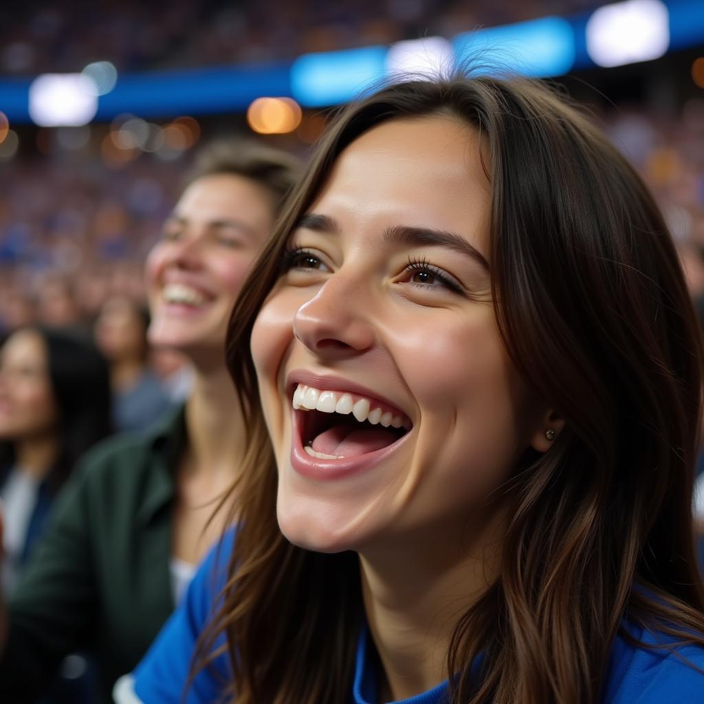 A fan smiling brightly while at a stadium, showcasing the pure joy of being present at the event