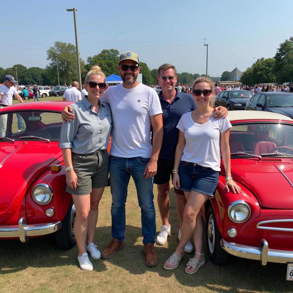 A group of Fiat owners gathered at a car meet