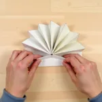 Folding a cardboard fan