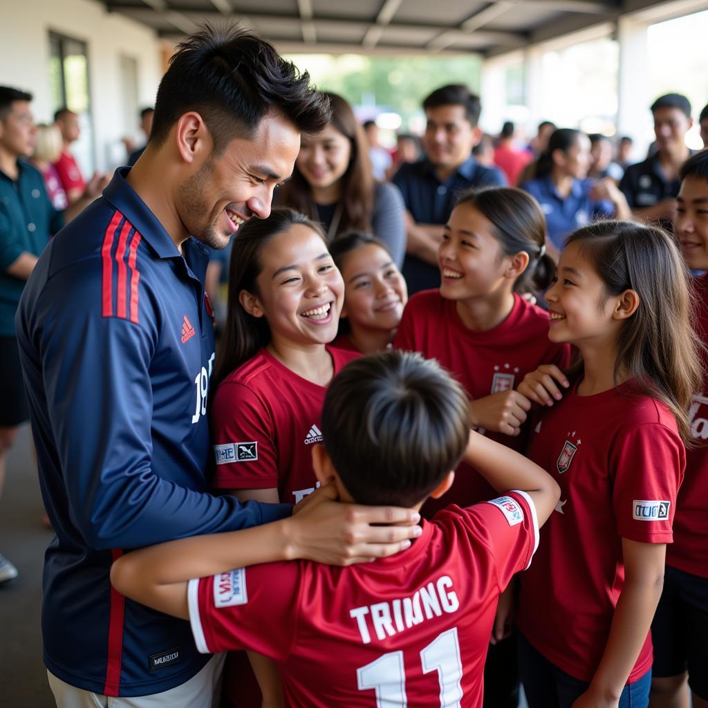 Hamlet Truong shares a laugh with young fans