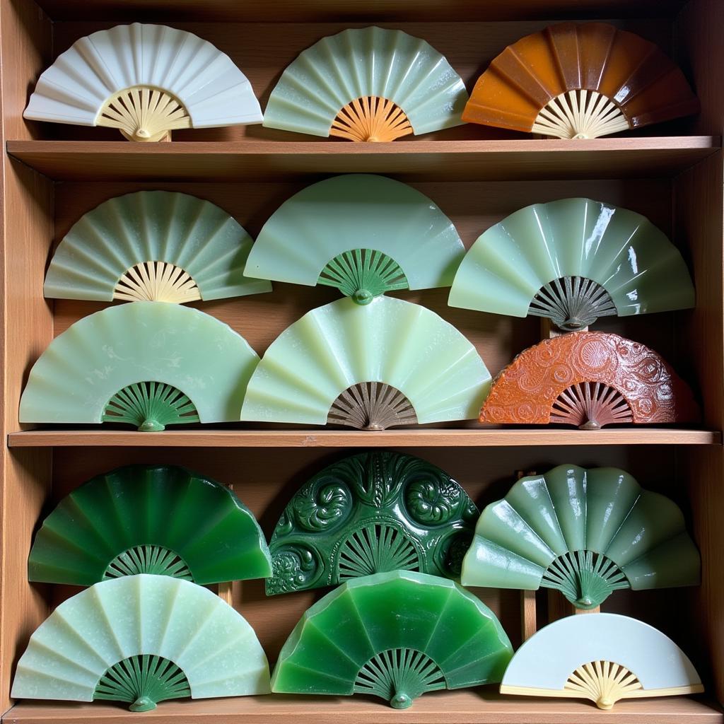 A collection of jade fans on display