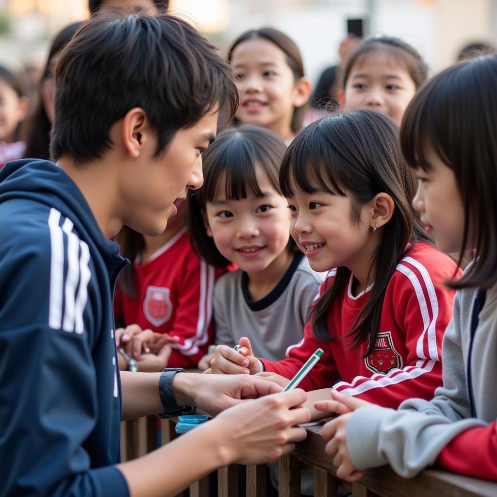 Japanese Football Star Interacting with Fans