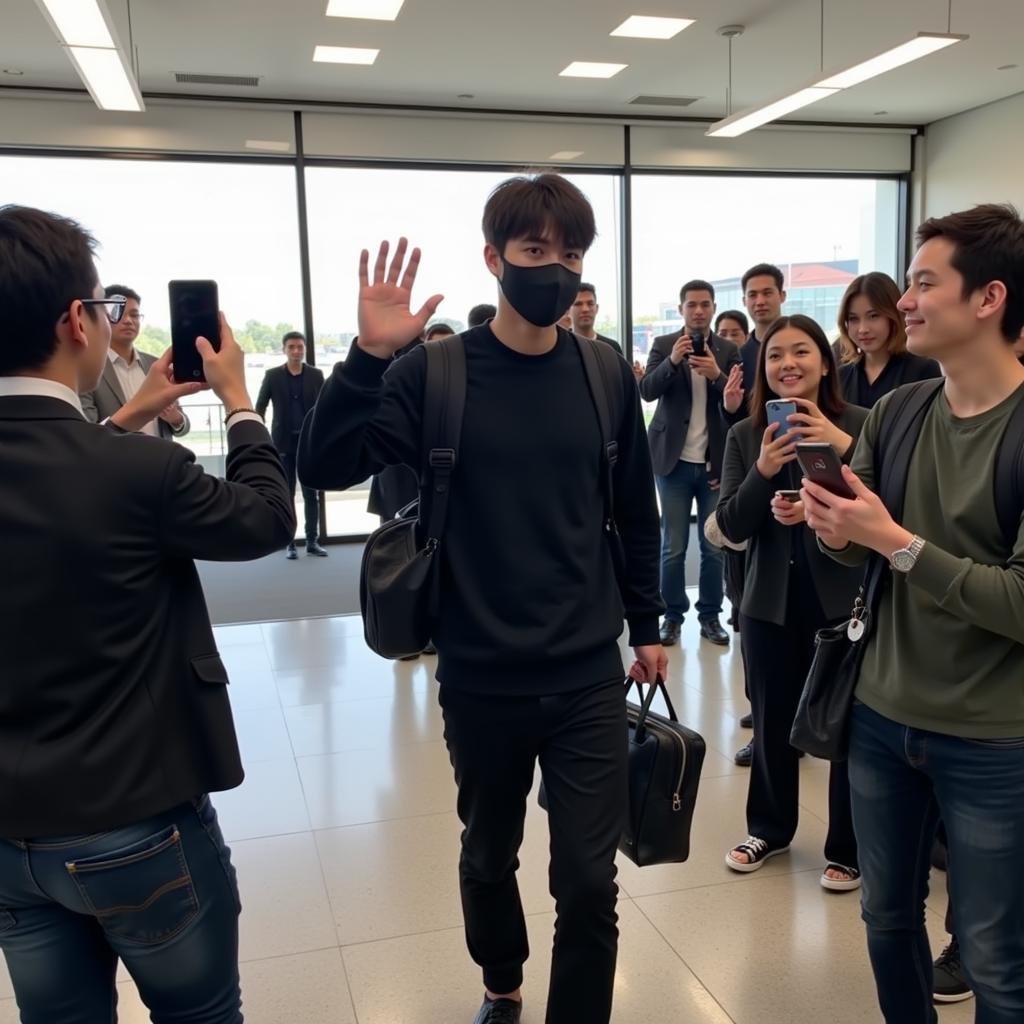 Jungkook waving to fans at the airport