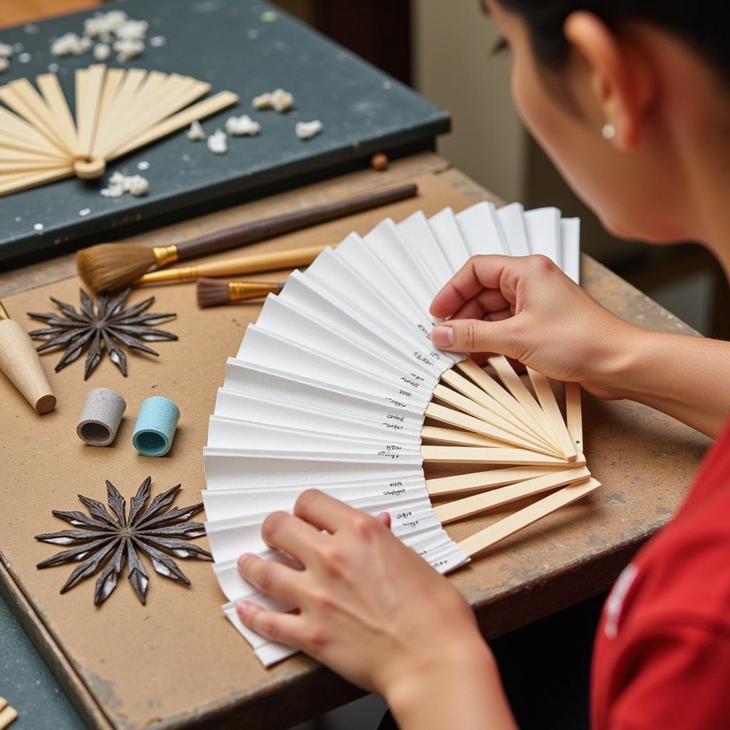 The process of making an accordion style fan