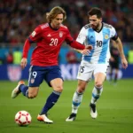 Luka Modric and Lionel Messi face off in a tense midfield battle