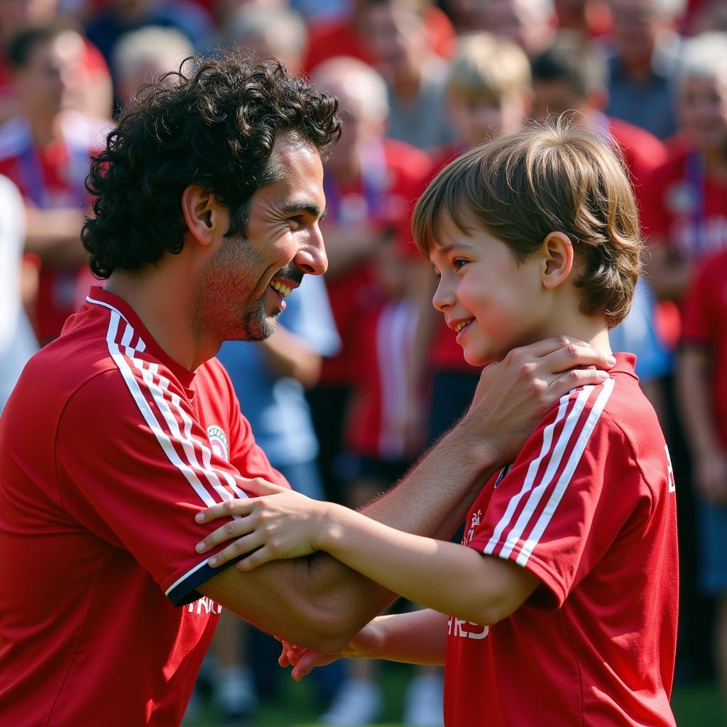 Raul Gonzalez signing an autograph for a young fan