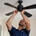 Electrician installing ceiling fan in Sutherland Shire