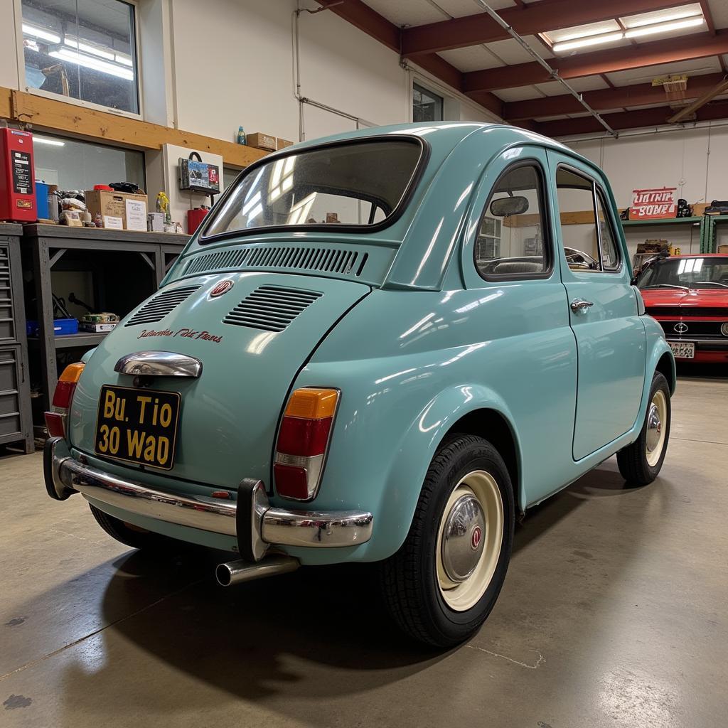 A vintage Fiat undergoing a meticulous restoration process