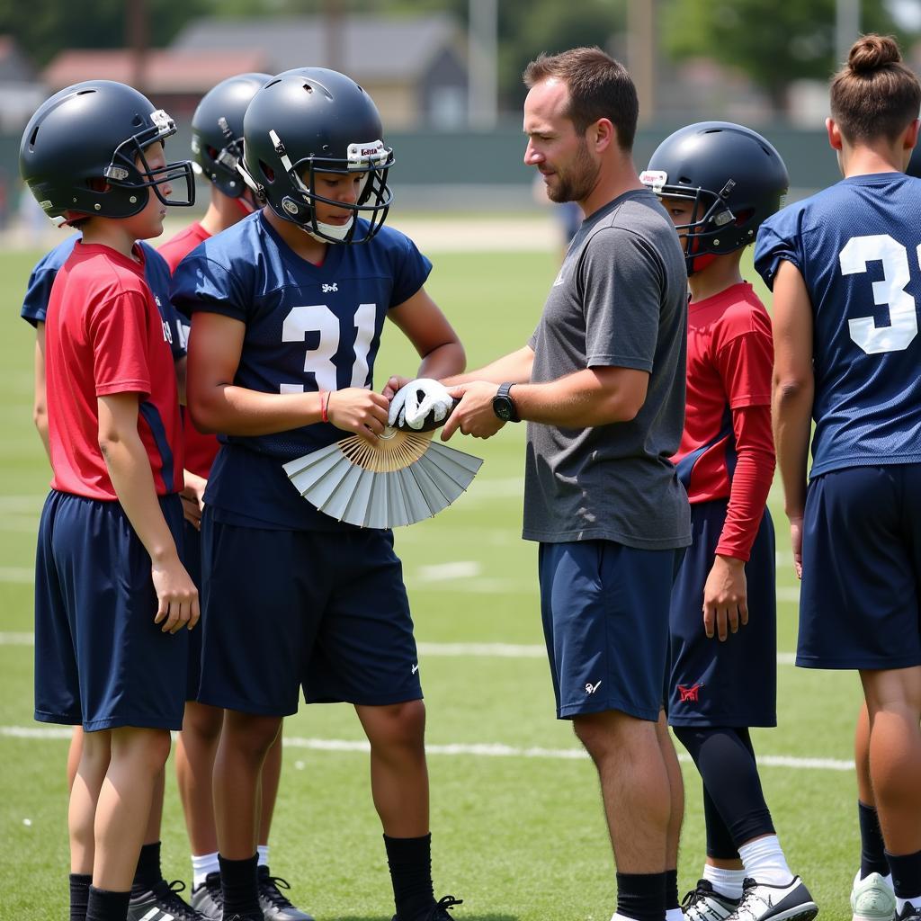 Youth Football Coach Demonstrating Fan Wrapping