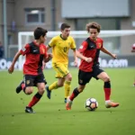 Two young soccer players sprinting towards the opponent's goal during a counter-attack