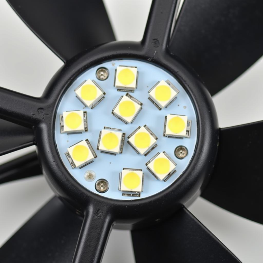 Close-up view of a 12cm LED fan with 15 bulbs illuminating.