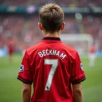 Antoine Griezmann as a child wearing a Manchester United jersey