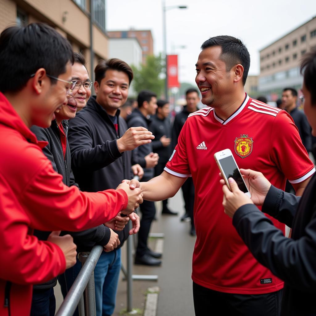 Chi Dân interacting with football fans