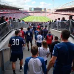 Fans Enjoying Fresh Air on Stadium Staircase