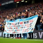 Fans Holding Supportive Banner