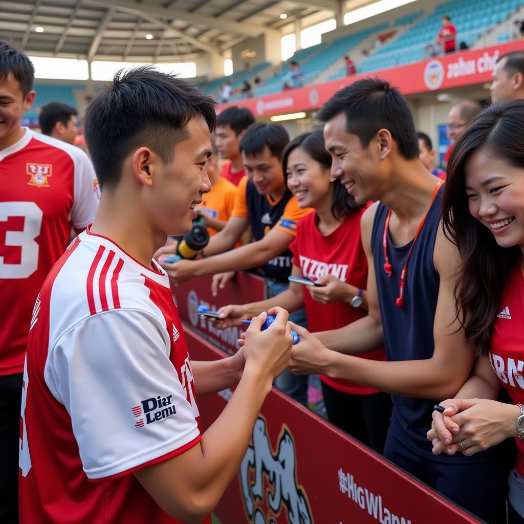 Lương Xuân Trường interacting with fans after a match