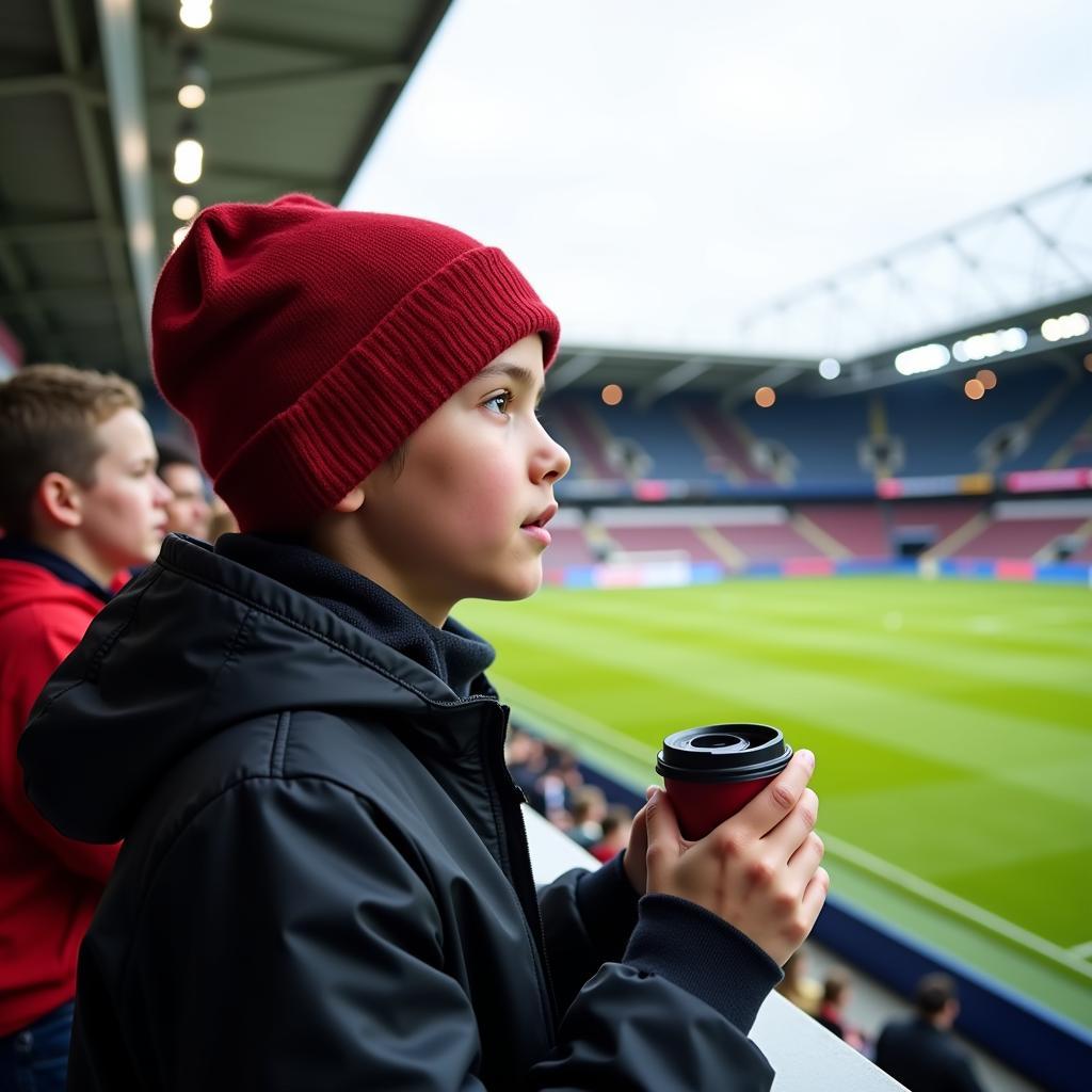 Modern Fan with Tea at Stadium