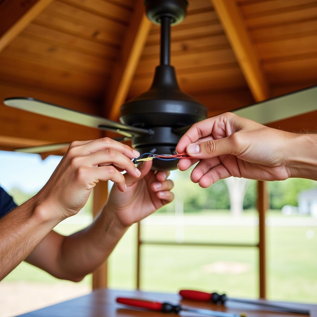 Installing a ceiling fan in a gazebo.