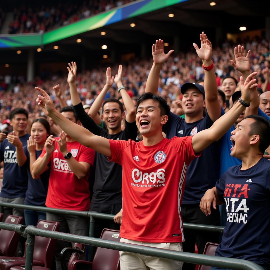 Excited fans cheering for Khau Hach Nam during a football match