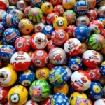 A collection of Kinder Surprise fan balls from various years