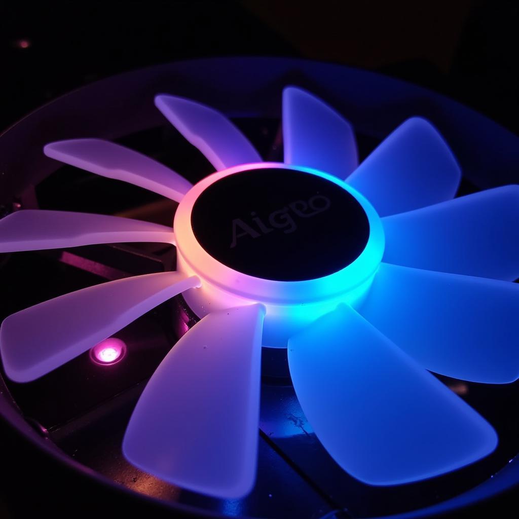 A close-up view of an Aigo Aurora fan displaying its vibrant RGB lighting.